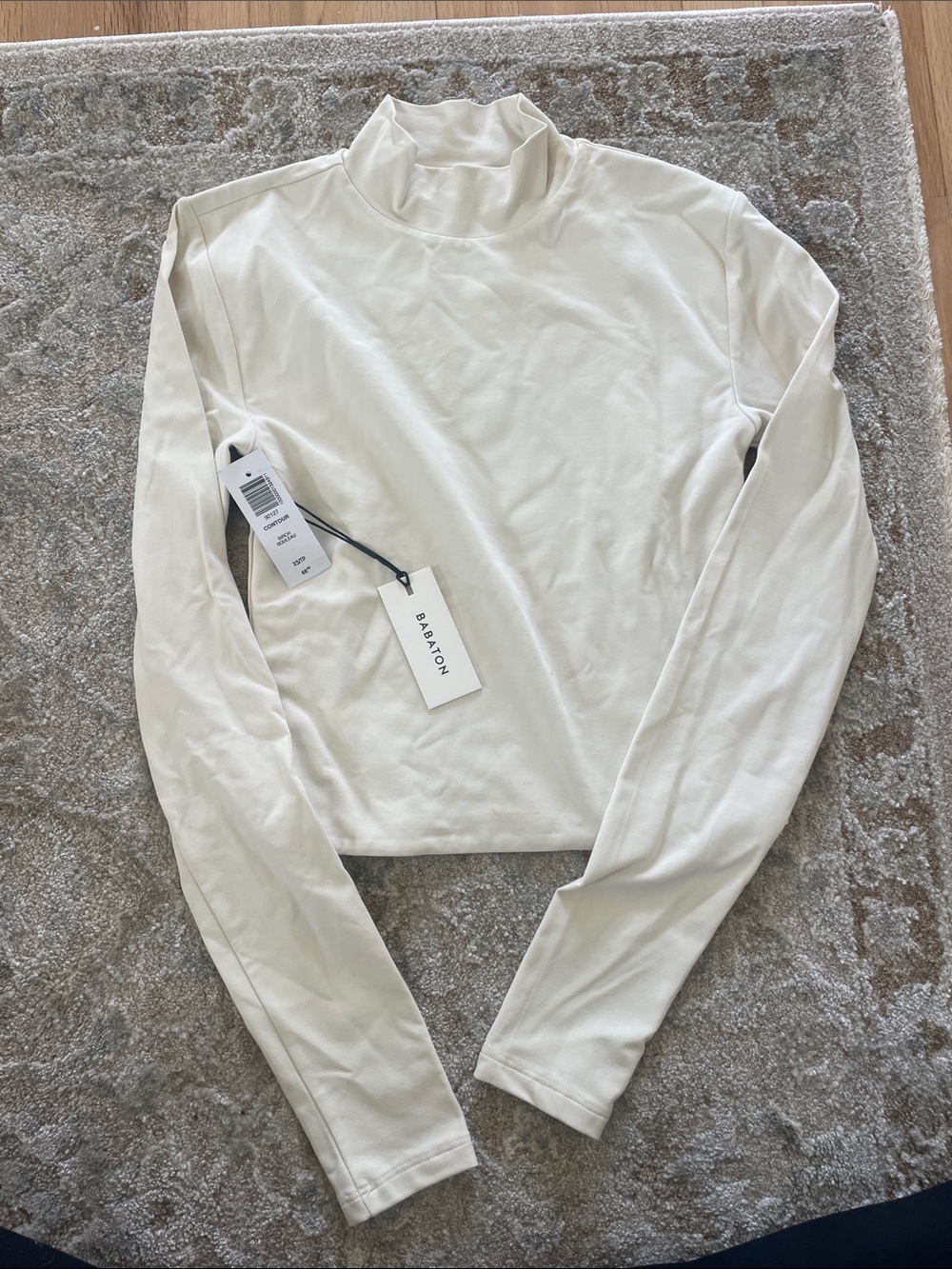 Aritzia Babaton Cream Long-Sleeve Mock Neck Crop Top. Out of Stock online!